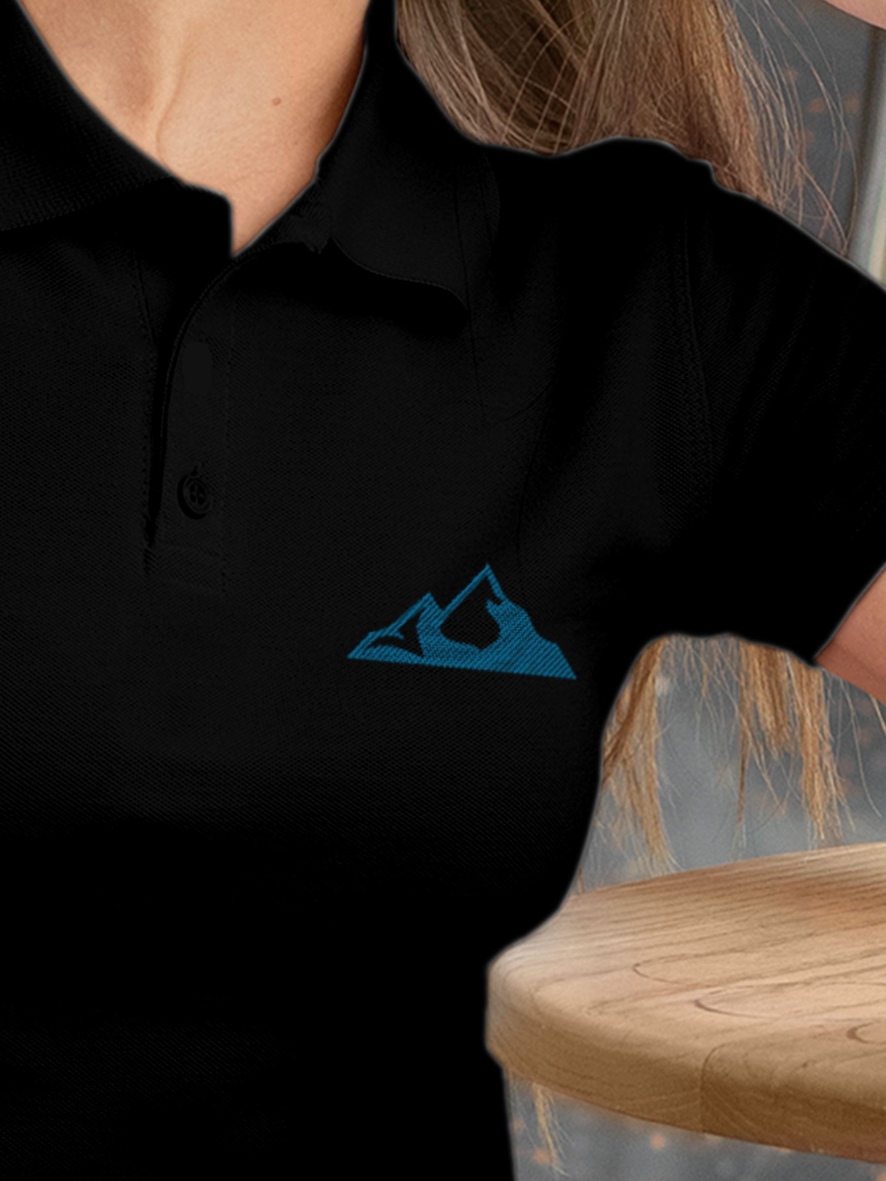 Close up of 'Grit' design on Women's Black Polo T-shirt, highlighting intricate details and vibrant print.