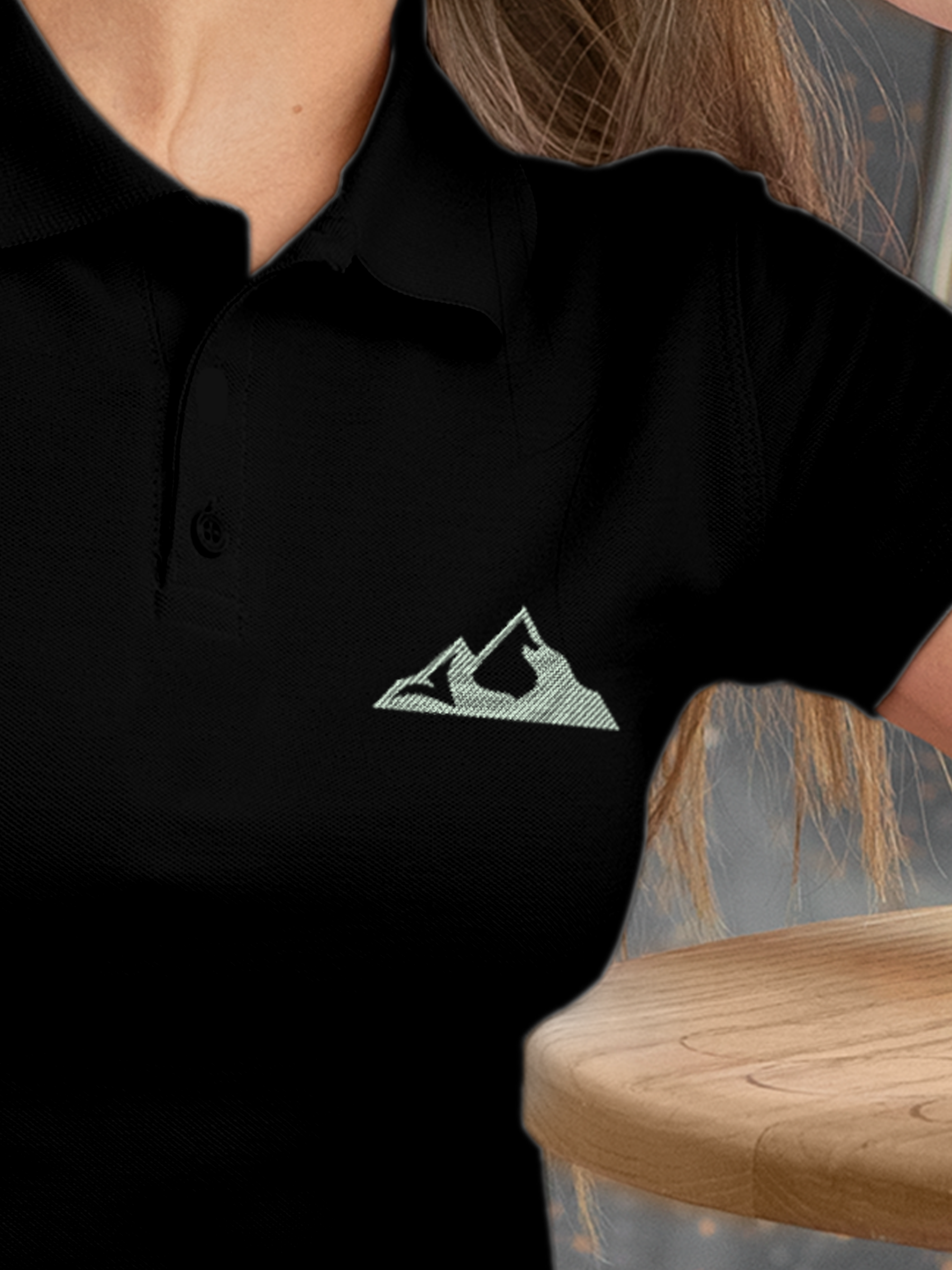 Close up of 'Grit' design on Women's Black Polo T-shirt, highlighting intricate details and vibrant print.
