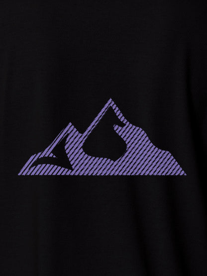 Close up of 'Grit' design on Women's Black Polo T-shirt, highlighting intricate details and vibrant print.