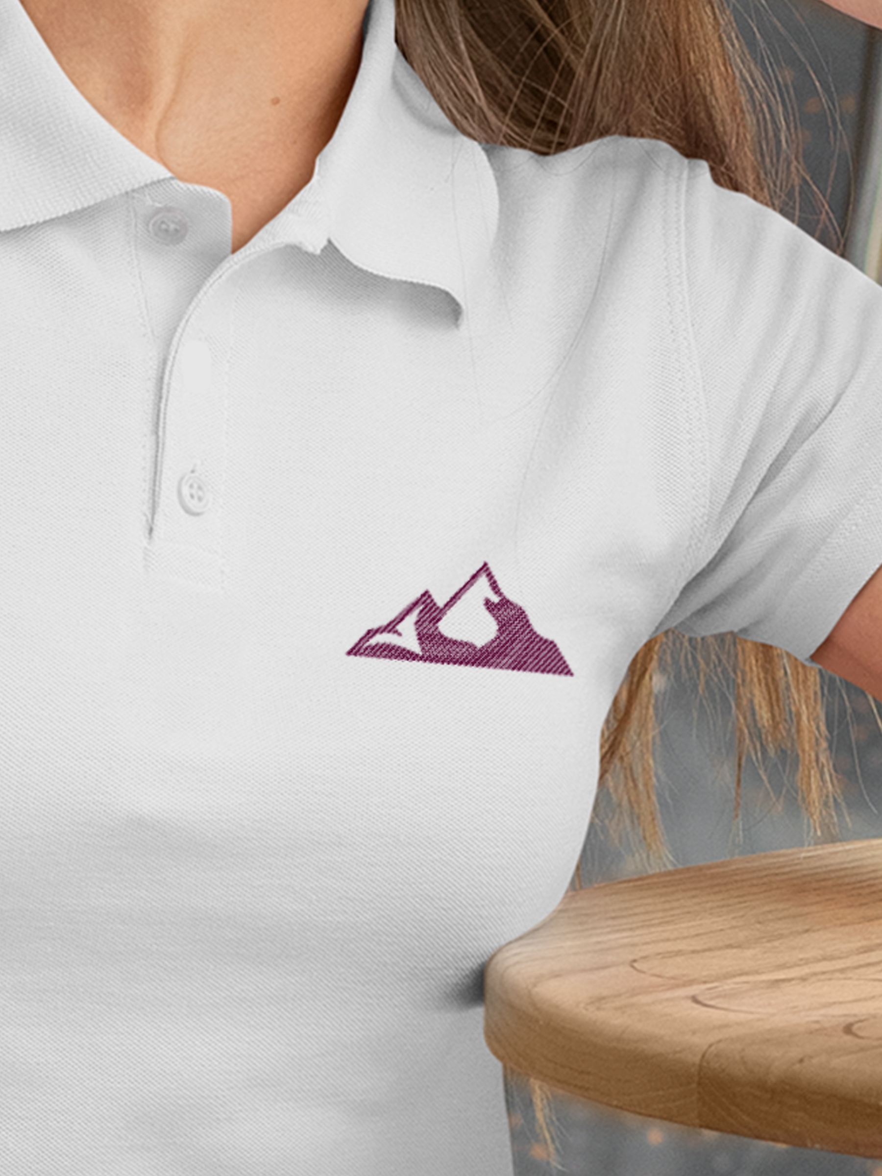 Close up of 'Grit' design on Women's White Polo T-shirt, highlighting intricate details and vibrant print.
