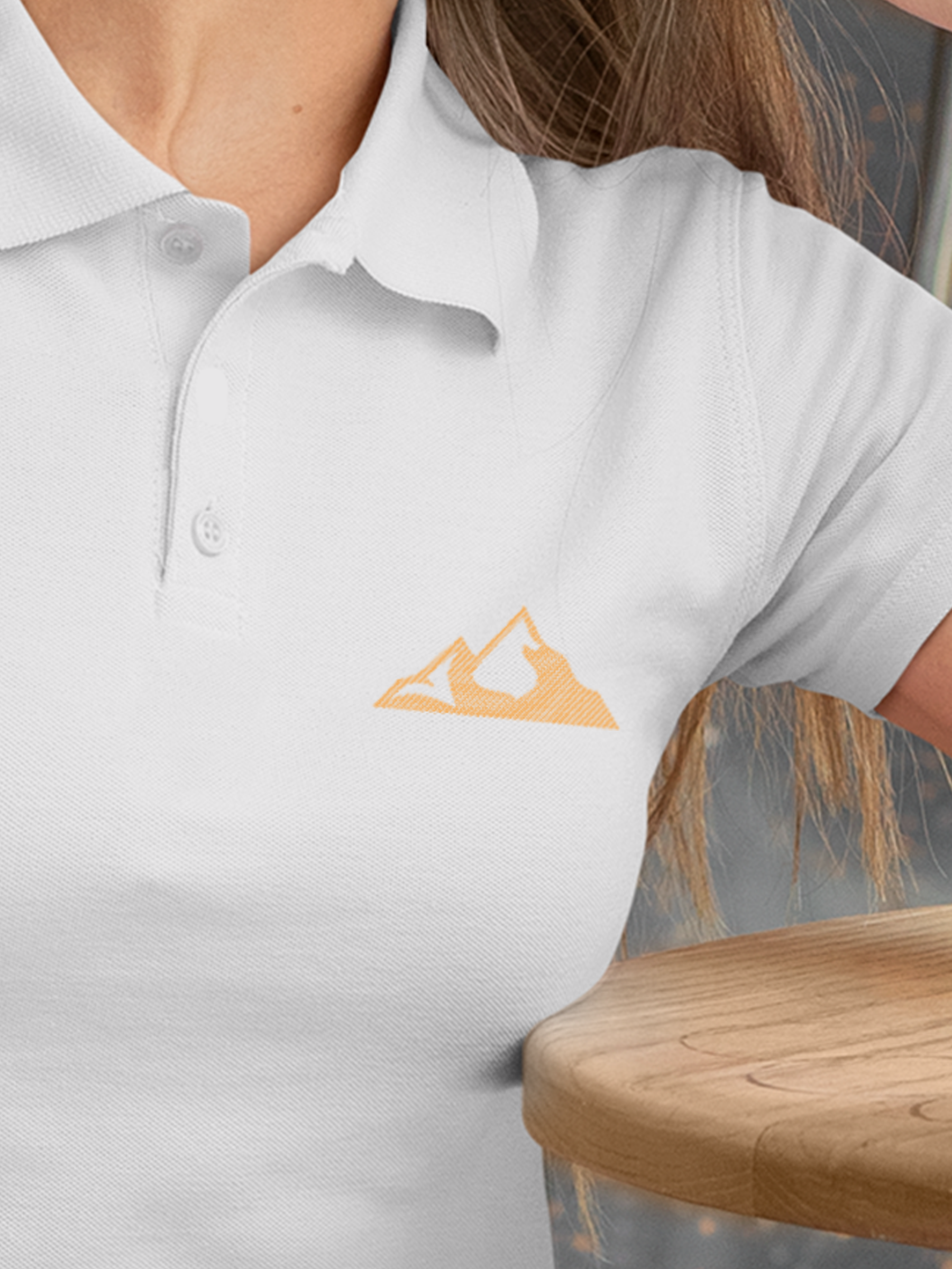 Close up of 'Grit' design on Women's White Polo T-shirt, highlighting intricate details and vibrant print.