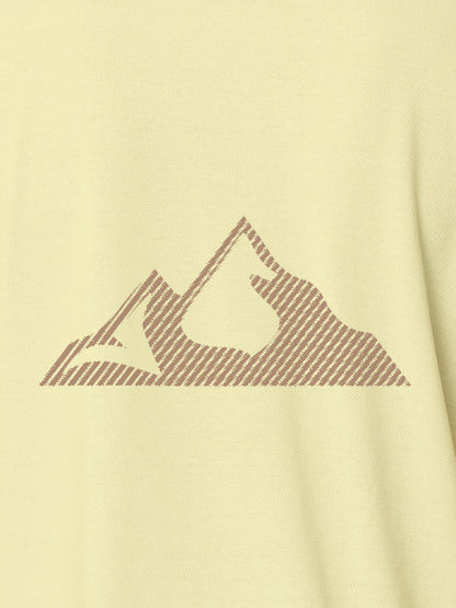 Close up of 'Grit' design on Women's Yellow Polo T-shirt, highlighting intricate details and vibrant print.