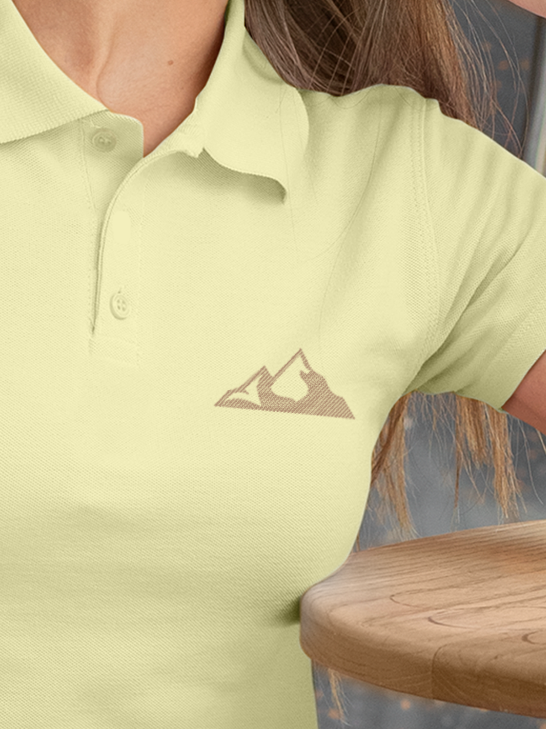 Close up of 'Grit' design on Women's Yellow Polo T-shirt, highlighting intricate details and vibrant print.