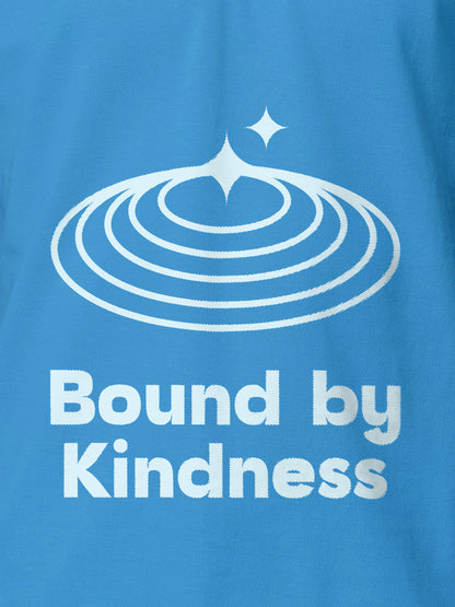 Close up of 'Bound By Kindness' design on Men's Blue Polo T-shirt, highlighting intricate details and vibrant print.