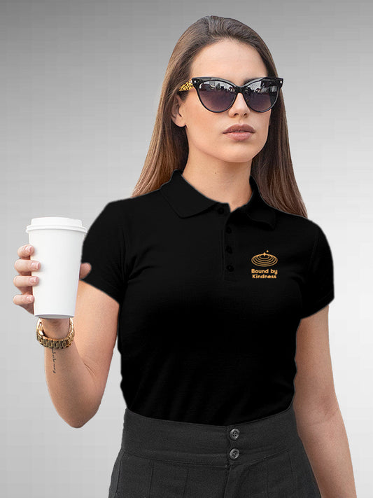 Model wearing Women's Black Polo T-shirt with 'Bound By Kindness' design, offering effortless style and premium comfort