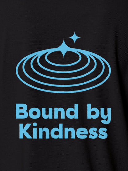 Close up of 'Bound By Kindness' design on Women's Dark Grey Polo T-shirt, highlighting intricate details and vibrant print.