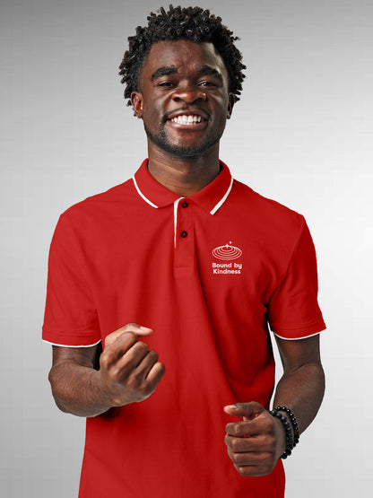 Model wearing Men's Red Polo T-shirt with 'Bound By Kindness' design, offering effortless style and premium comfort
