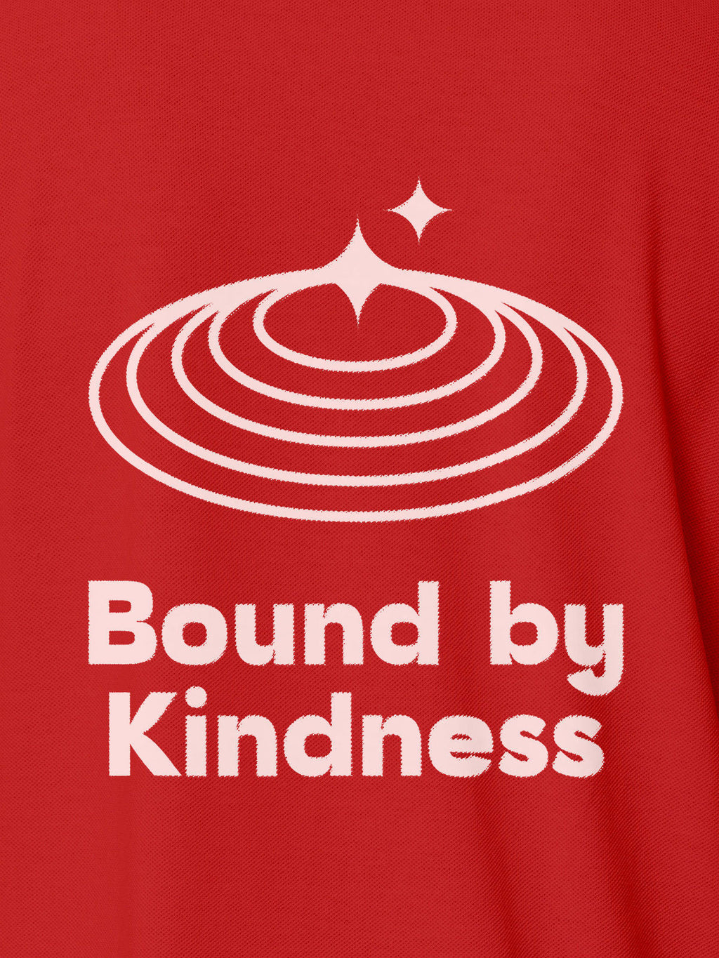 Close up of 'Bound By Kindness' design on Women's Red Polo T-shirt, highlighting intricate details and vibrant print.