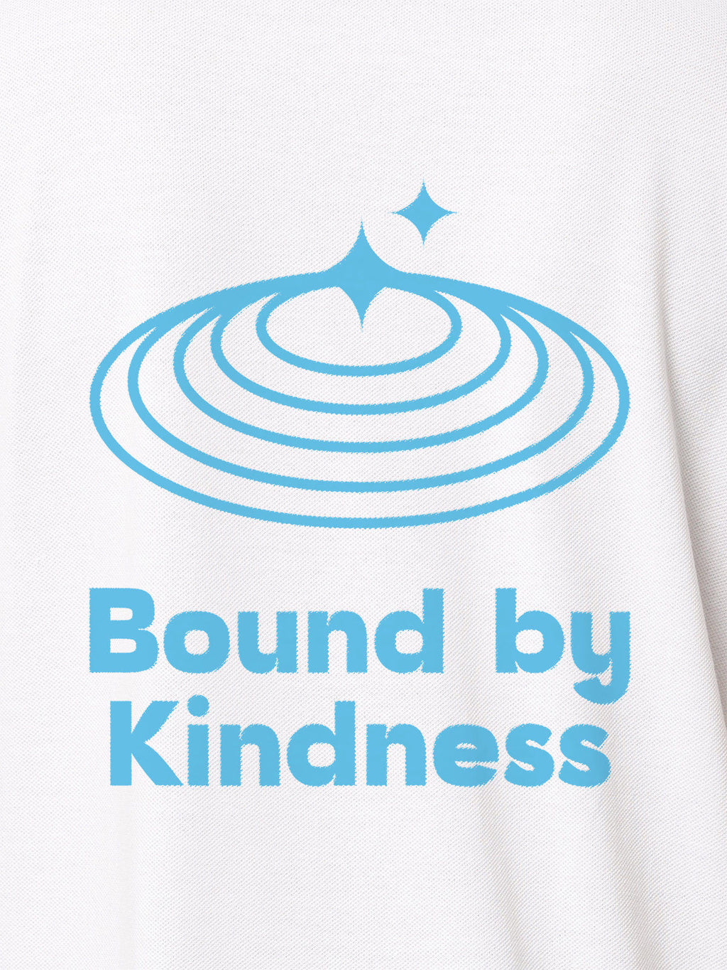 Close up of 'Bound By Kindness' design on Women's White Polo T-shirt, highlighting intricate details and vibrant print.
