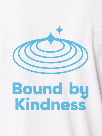 Close up of 'Bound By Kindness' design on Women's White Polo T-shirt, highlighting intricate details and vibrant print.