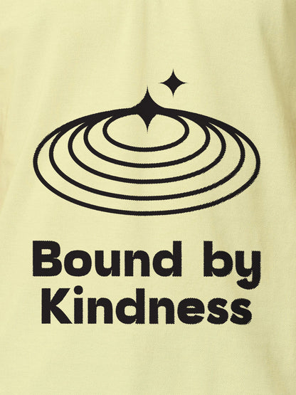 Close up of 'Bound By Kindness' design on Men's Yellow Polo T-shirt, highlighting intricate details and vibrant print.
