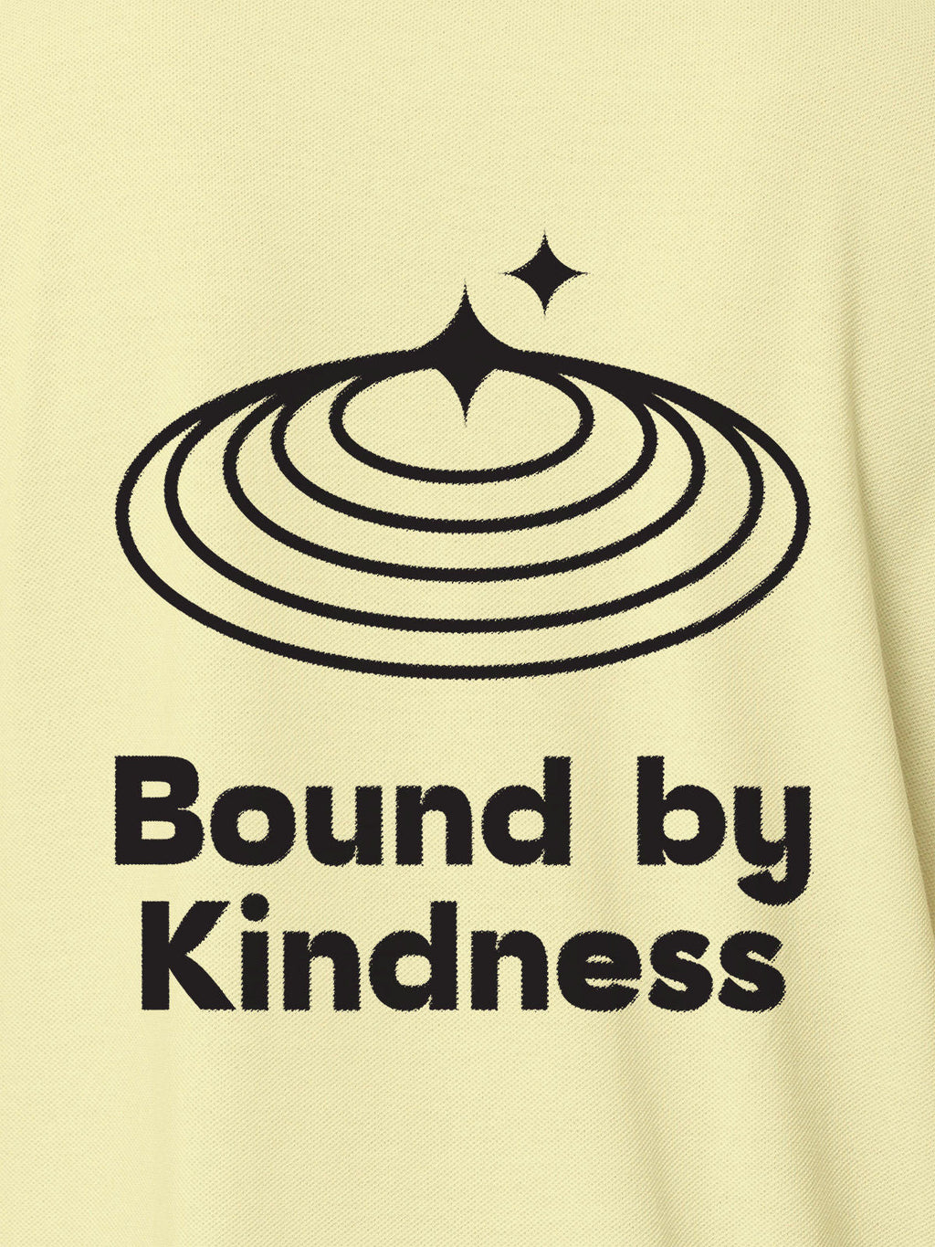 Close up of 'Bound By Kindness' design on Women's Yellow Polo T-shirt, highlighting intricate details and vibrant print.