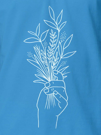 Close up of 'Love and Joy' design on Women's Blue Polo T-shirt, highlighting intricate details and vibrant print.
