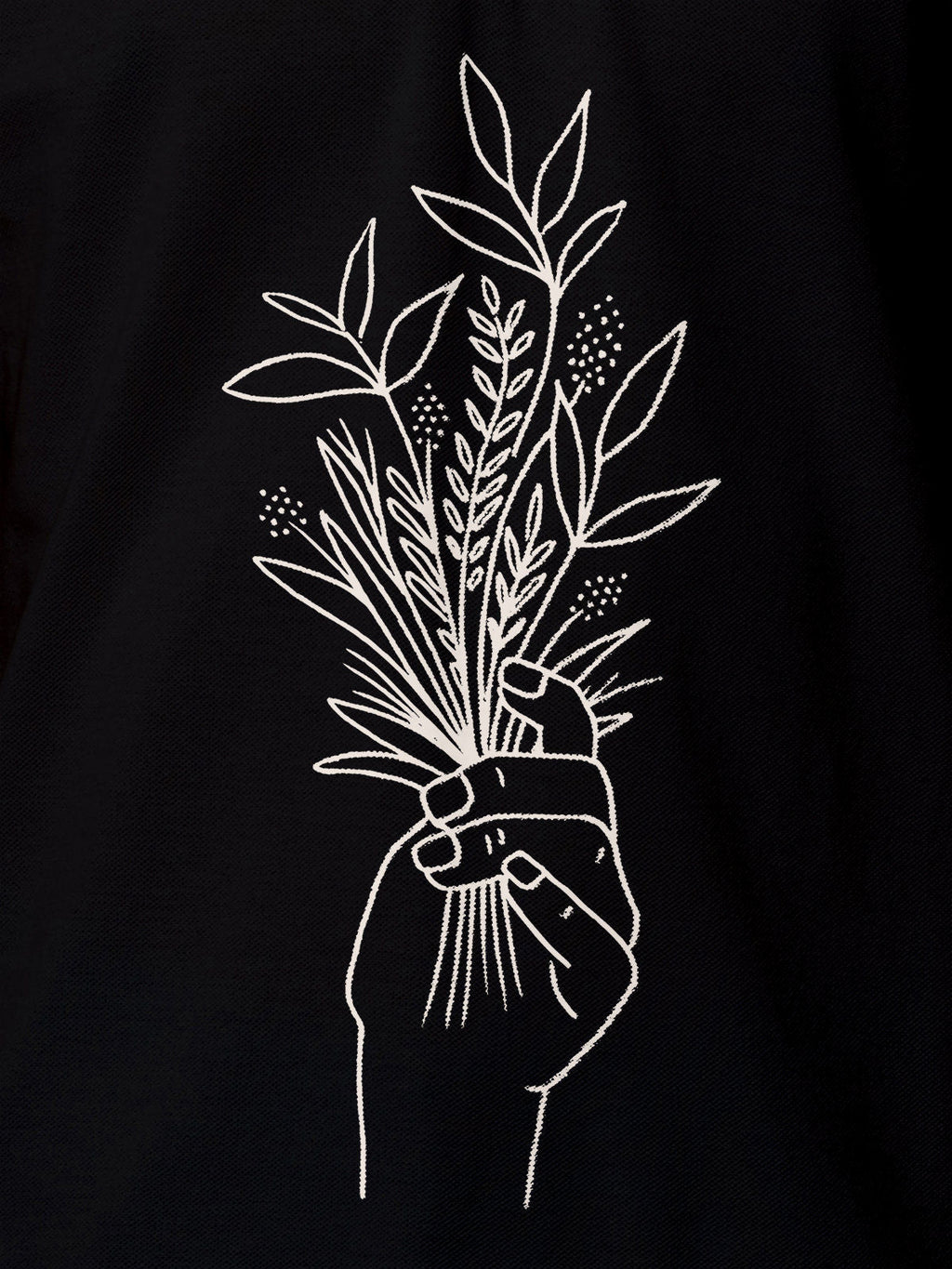 Close up of 'Love and Joy' design on Women's Black Polo T-shirt, highlighting intricate details and vibrant print.