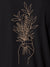 Close up of 'Love and Joy' design on Men's Dark Grey Polo T-shirt, highlighting intricate details and vibrant print.