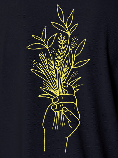 Close up of 'Love and Joy' design on Men's Navy Blue Polo T-shirt, highlighting intricate details and vibrant print.