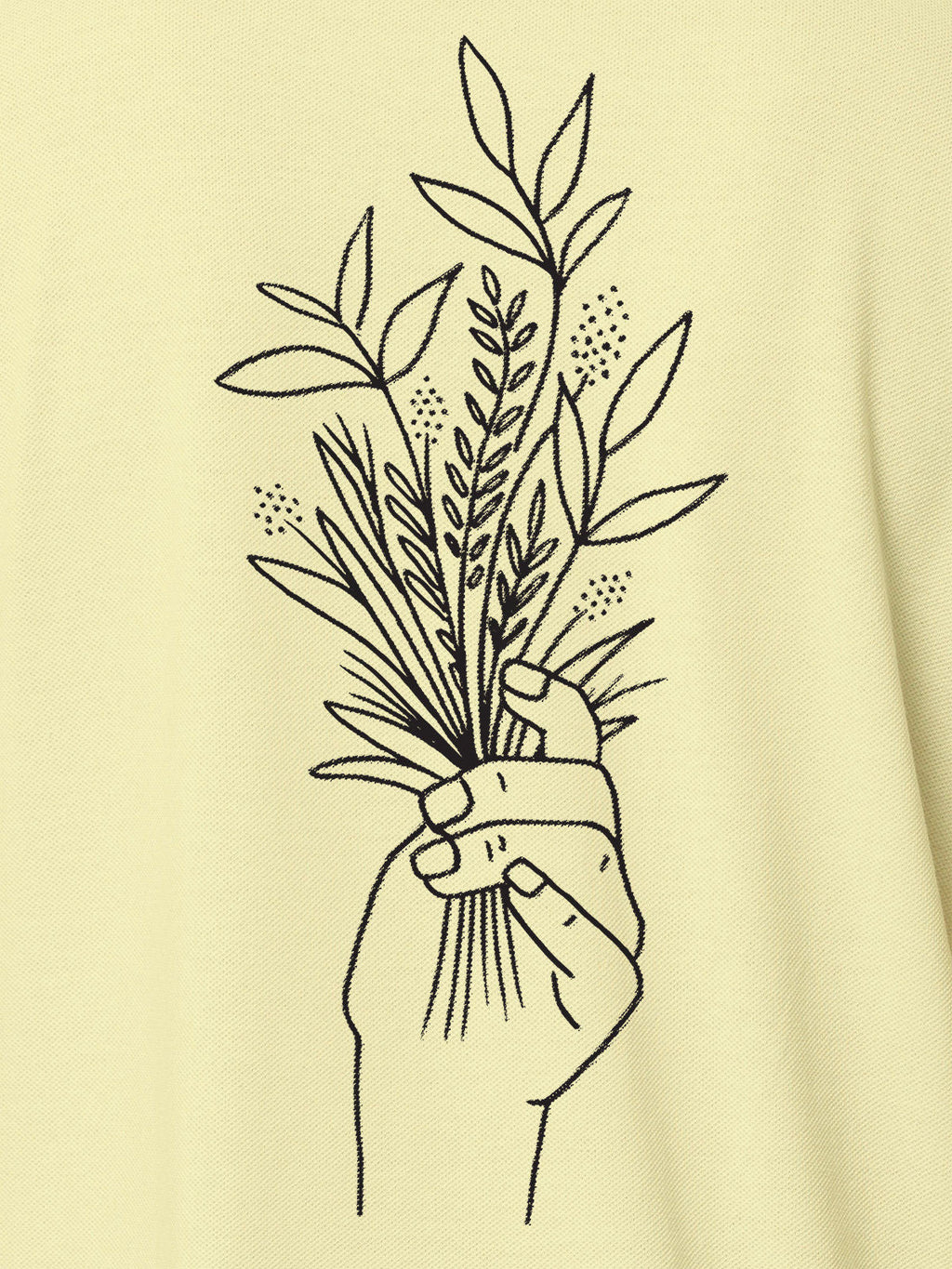 Close up of 'Love and Joy' design on Men's Yellow Polo T-shirt, highlighting intricate details and vibrant print.