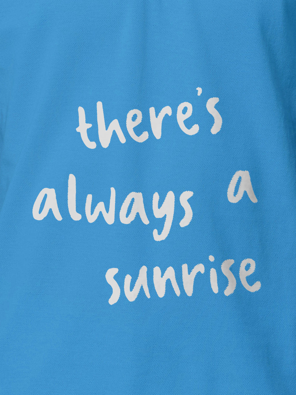 Close up of 'There's Always a Sunrise' design on Men's Blue Polo T-shirt, highlighting intricate details and vibrant print.