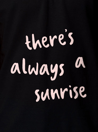 Close up of 'There's Always a Sunrise' design on Men's Black Polo T-shirt, highlighting intricate details and vibrant print.