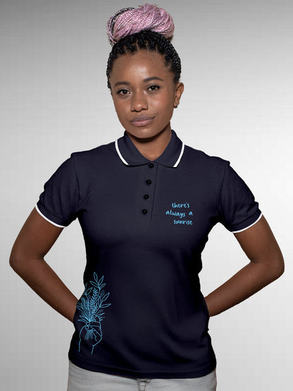 Model wearing Women's Navy Blue Polo T-shirt with 'There's Always a Sunrise' design, offering effortless style and premium comfort