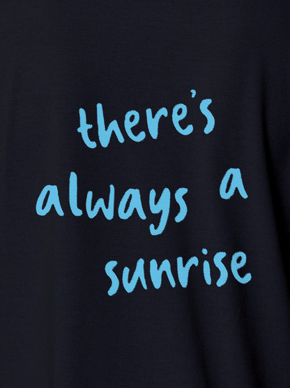 Close up of 'There's Always a Sunrise' design on Women's Navy Blue Polo T-shirt, highlighting intricate details and vibrant print.