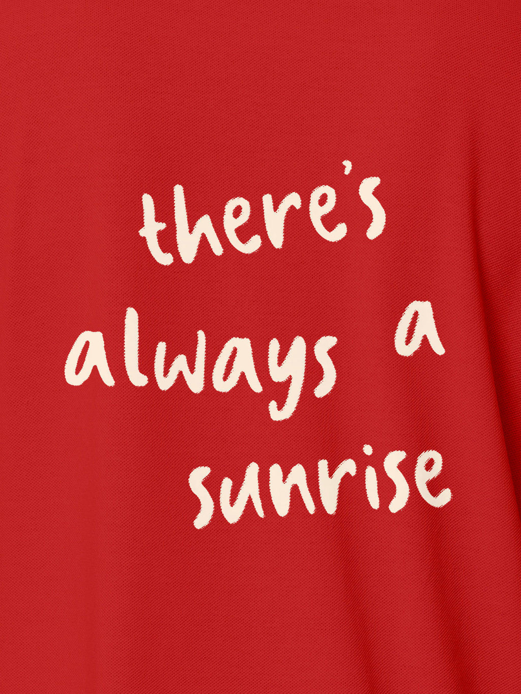 Close up of 'There's Always a Sunrise' design on Women's Red Polo T-shirt, highlighting intricate details and vibrant print.
