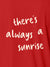 Close up of 'There's Always a Sunrise' design on Women's Red Polo T-shirt, highlighting intricate details and vibrant print.
