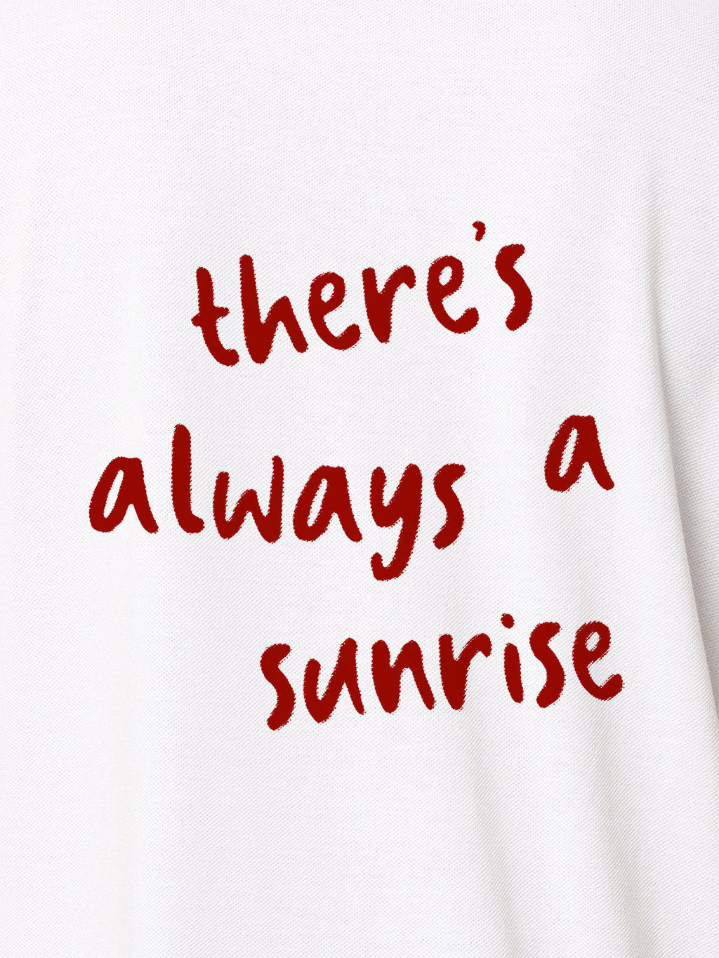 Close up of 'There's Always a Sunrise' design on Women's White Polo T-shirt, highlighting intricate details and vibrant print.