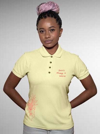 Model wearing Women's Yellow Polo T-shirt with 'There's Always a Sunrise' design, offering effortless style and premium comfort