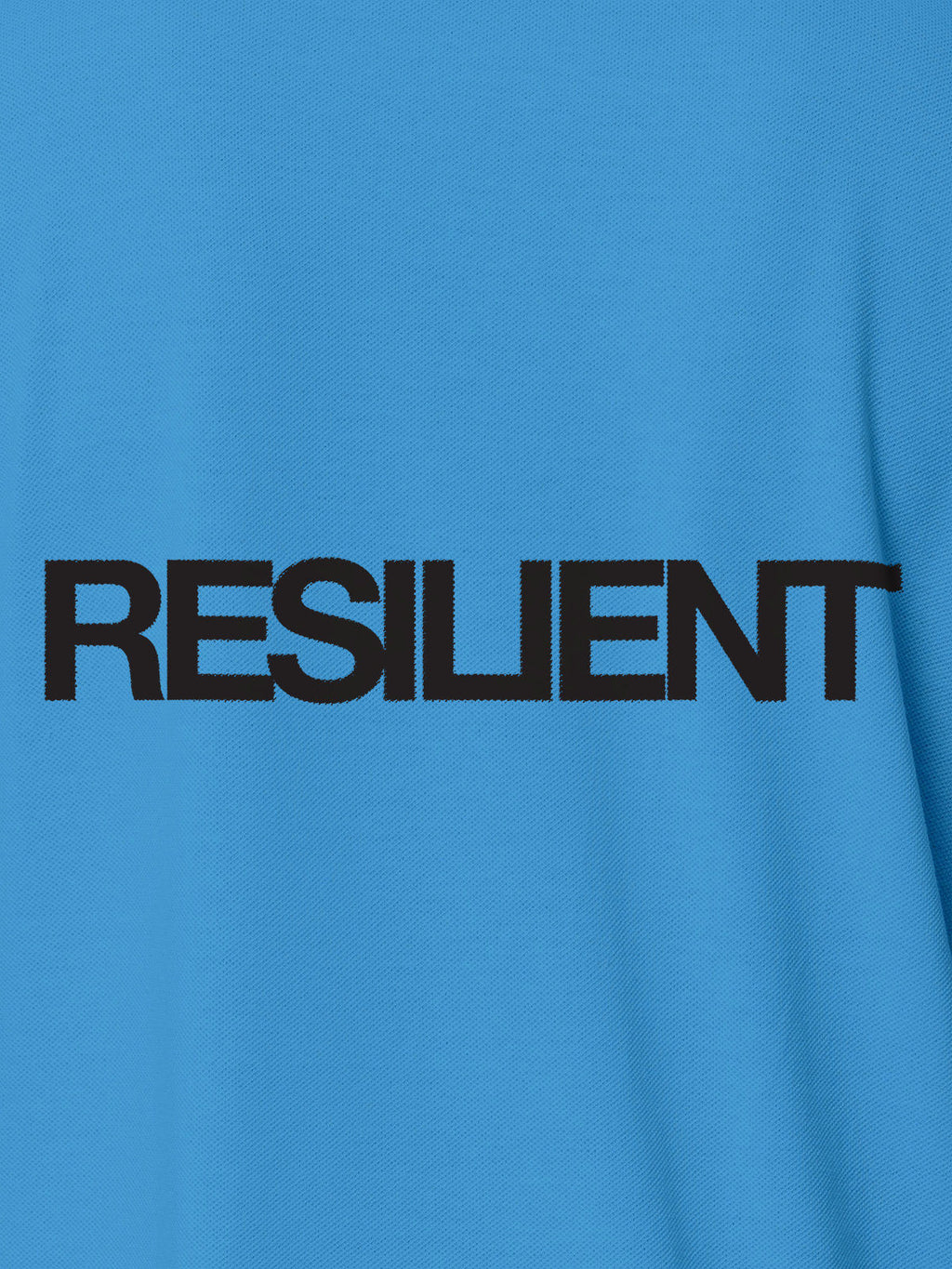 Close up of 'Resilient' design on Men's Blue Polo T-shirt, highlighting intricate details and vibrant print.