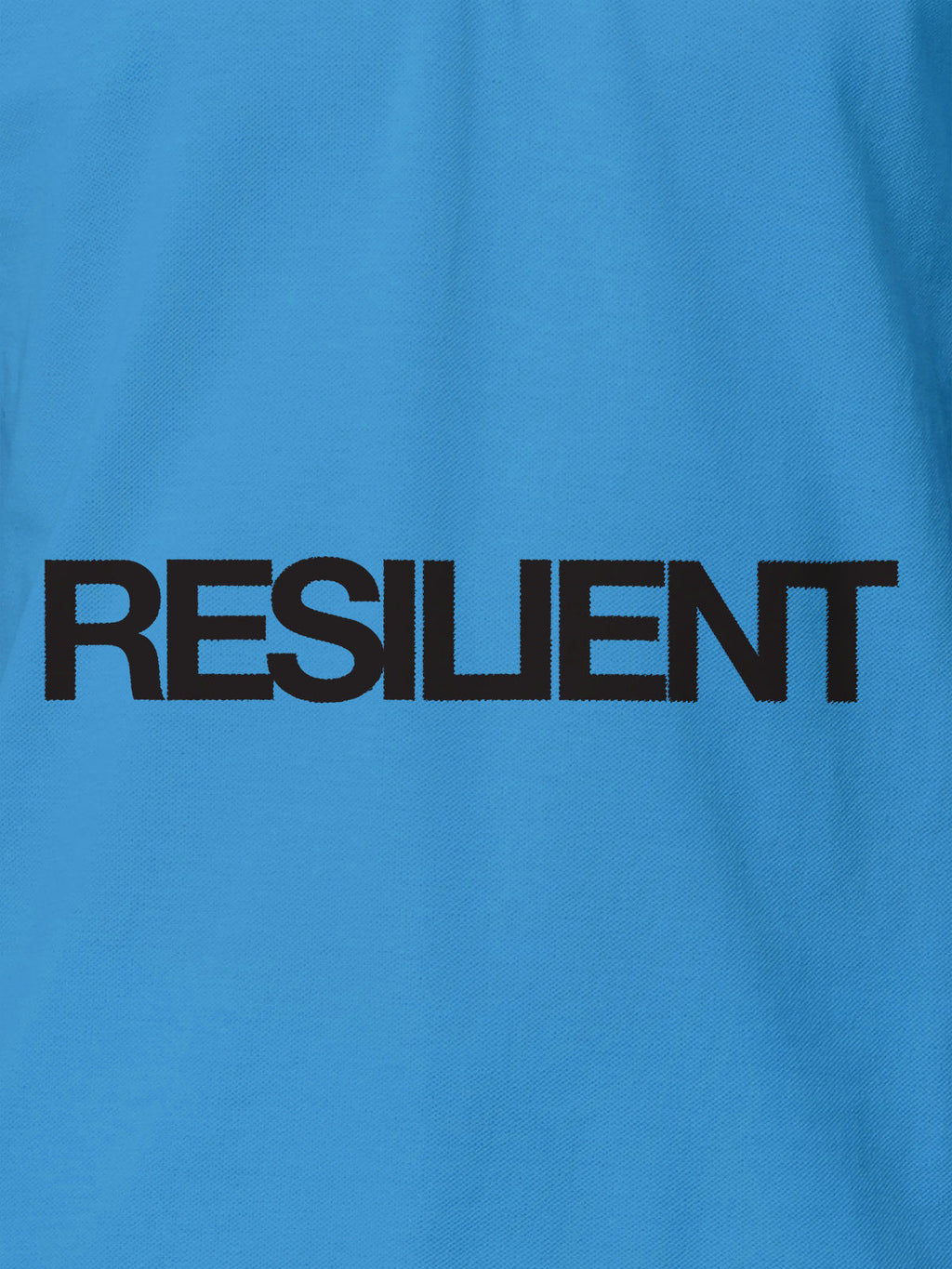 Close up of 'Resilient' design on Women's Blue Polo T-shirt, highlighting intricate details and vibrant print.