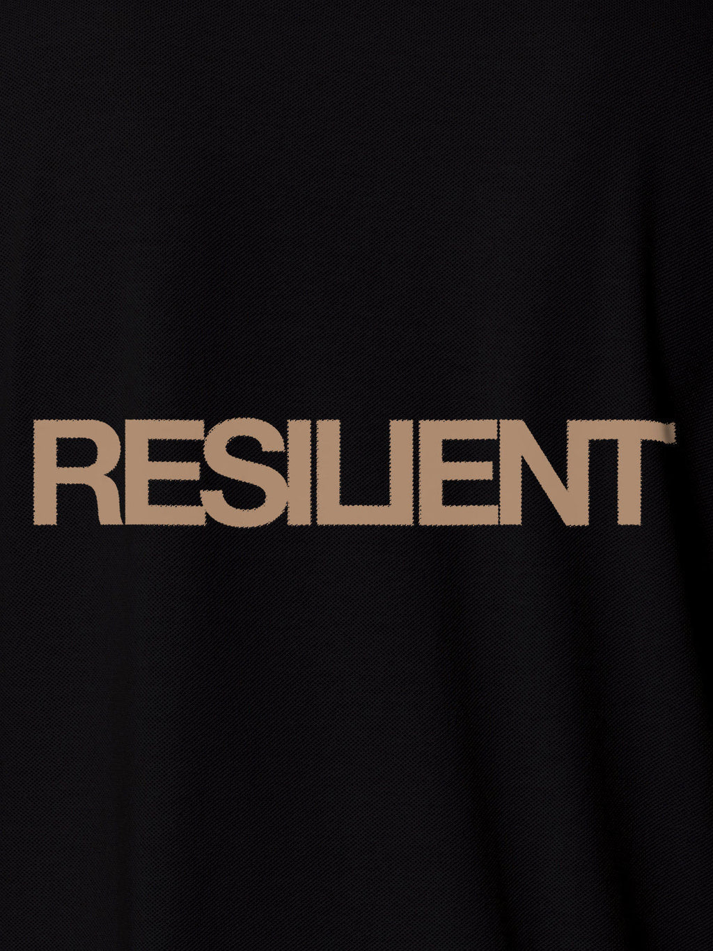 Close up of 'Resilient' design on Men's Black Polo T-shirt, highlighting intricate details and vibrant print.