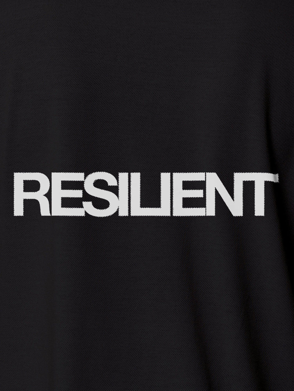 Close up of 'Resilient' design on Men's Dark Grey Polo T-shirt, highlighting intricate details and vibrant print.
