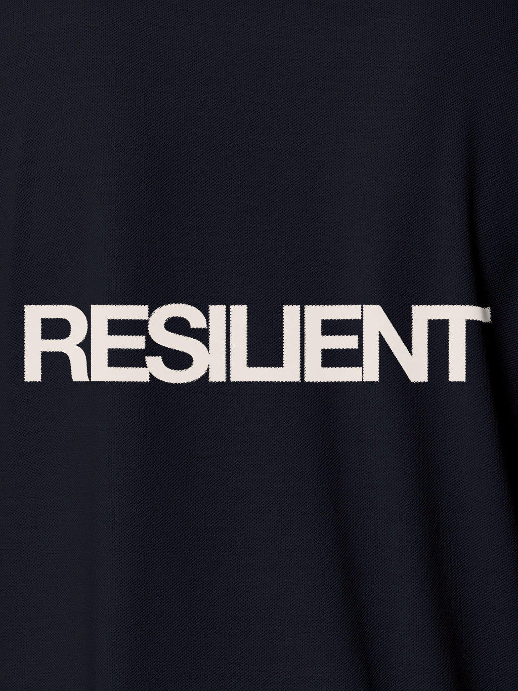 Close up of 'Resilient' design on Men's Navy Blue Polo T-shirt, highlighting intricate details and vibrant print.