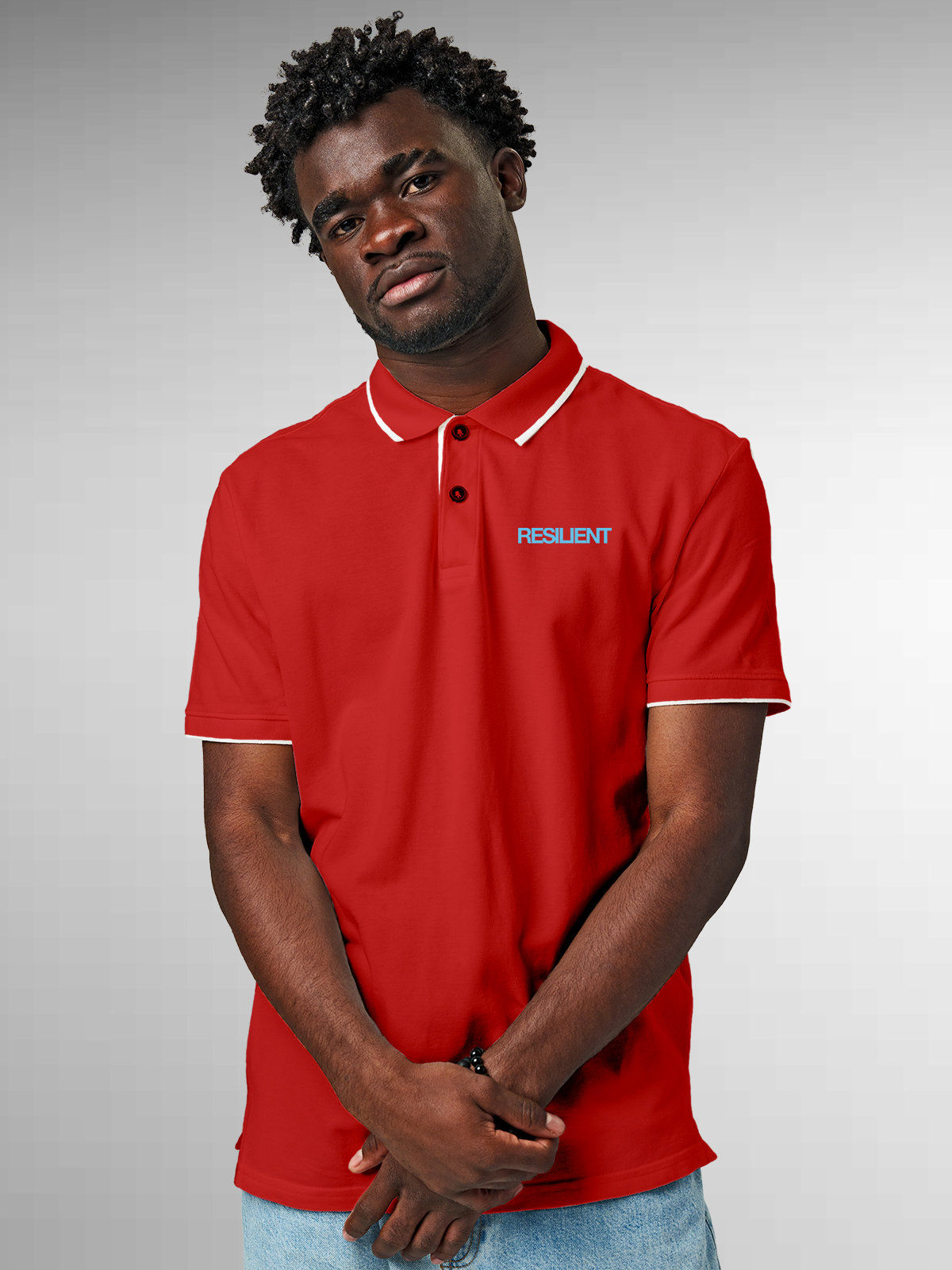 Model wearing Men's Red Polo T-shirt with 'Resilient' design, offering effortless style and premium comfort