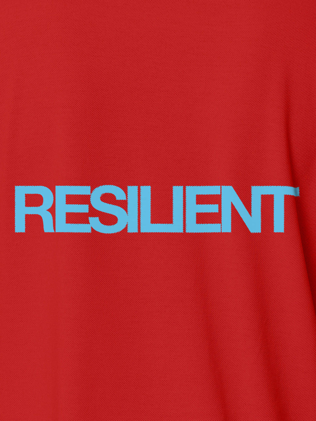 Close up of 'Resilient' design on Men's Red Polo T-shirt, highlighting intricate details and vibrant print.