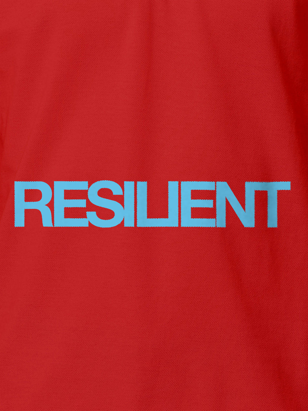 Close up of 'Resilient' design on Women's Red Polo T-shirt, highlighting intricate details and vibrant print.