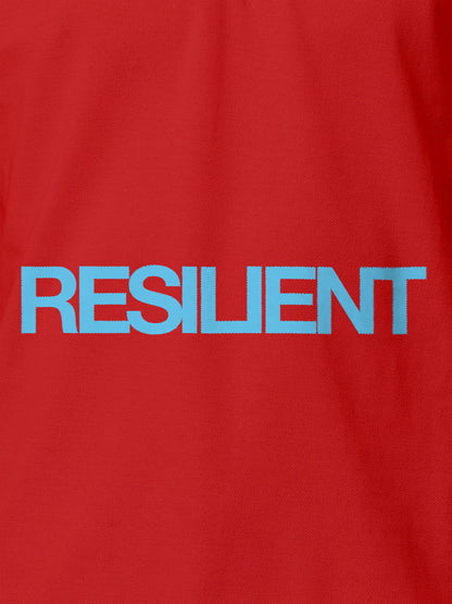 Close up of 'Resilient' design on Women's Red Polo T-shirt, highlighting intricate details and vibrant print.