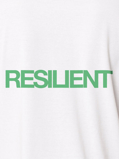 Close up of 'Resilient' design on Men's White Polo T-shirt, highlighting intricate details and vibrant print.