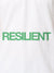 Close up of 'Resilient' design on Women's White Polo T-shirt, highlighting intricate details and vibrant print.