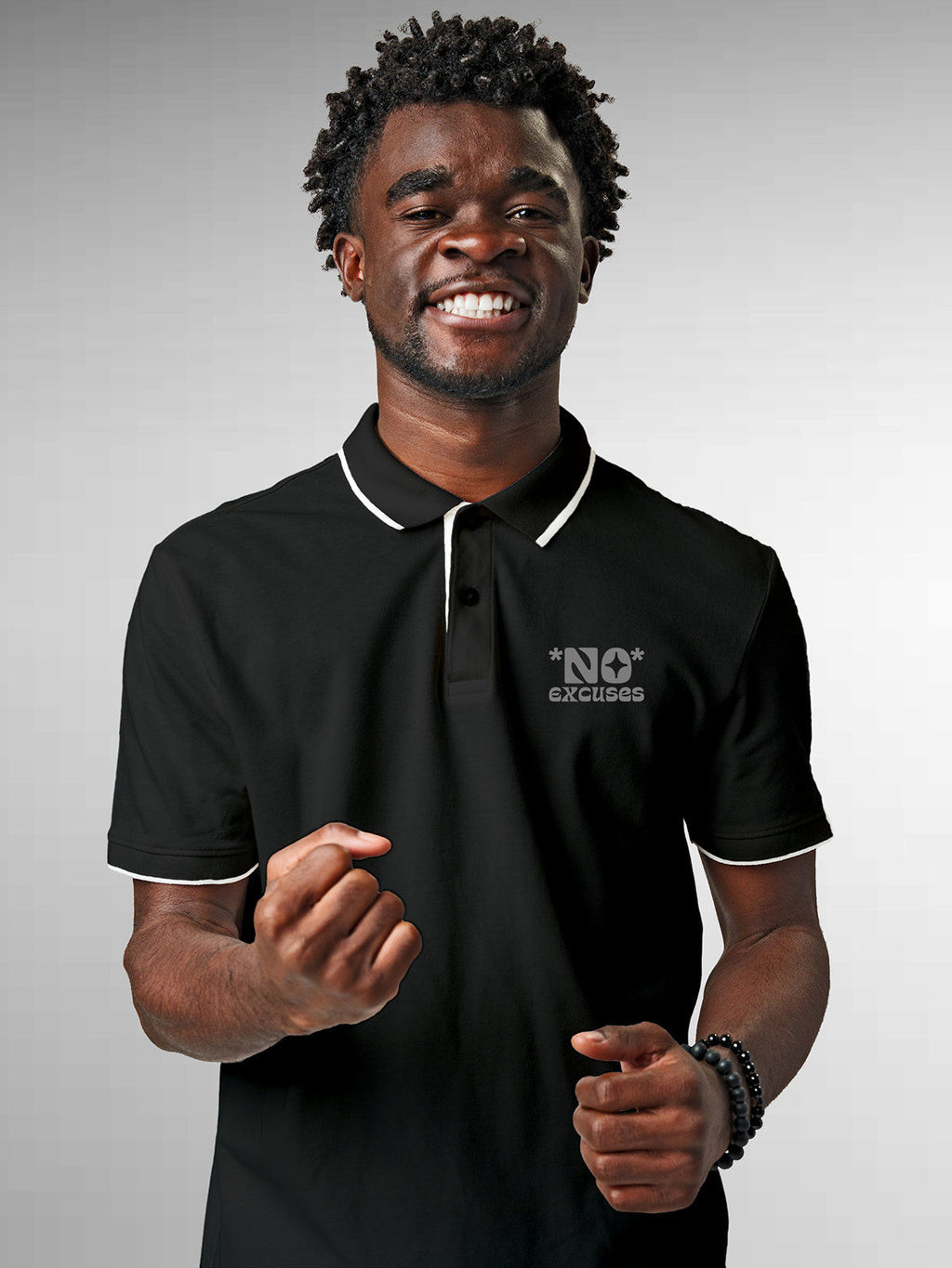 Model wearing Men's Dark Grey Polo T-shirt with 'No Excuses' design, offering effortless style and premium comfort