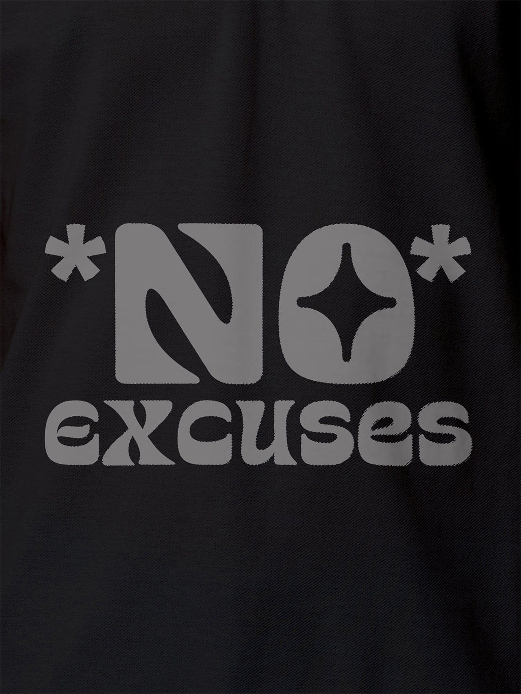 Close up of 'No Excuses' design on Men's Dark Grey Polo T-shirt, highlighting intricate details and vibrant print.