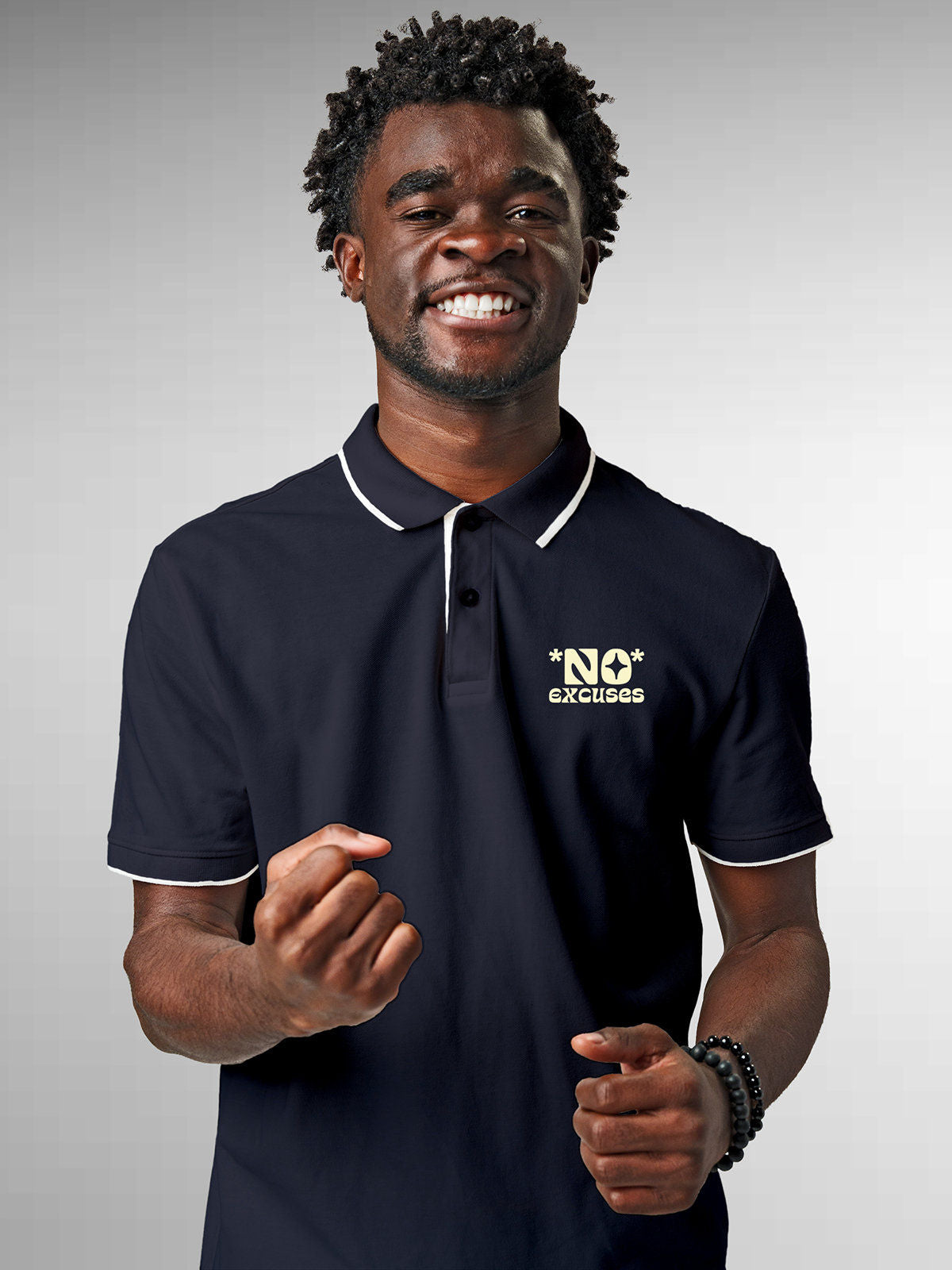 Model wearing Men's Navy Blue Polo T-shirt with 'No Excuses' design, offering effortless style and premium comfort