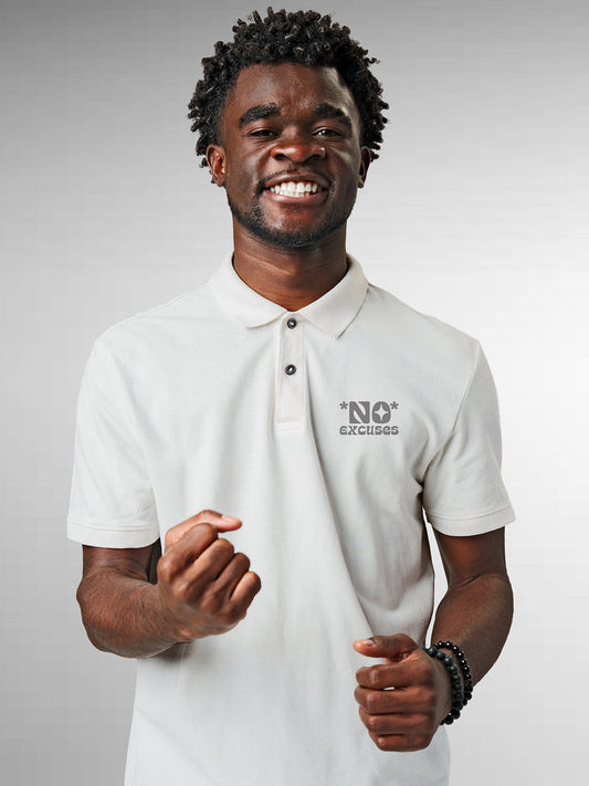 Model wearing Men's White Polo T-shirt with 'No Excuses' design, offering effortless style and premium comfort
