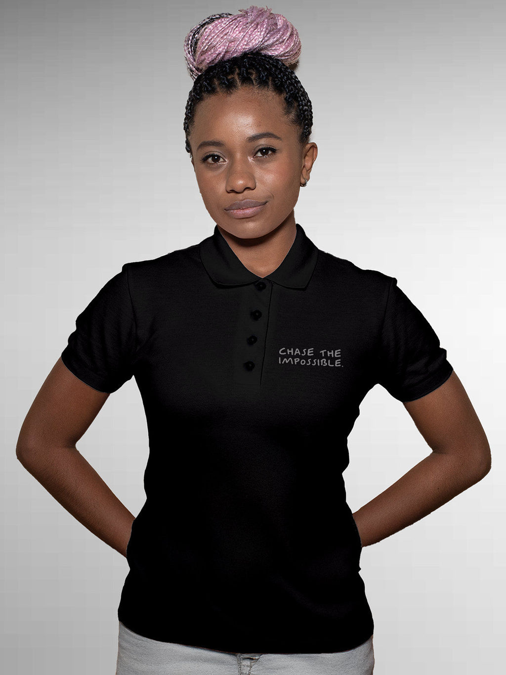 Model wearing Women's Black Polo T-shirt with 'Chase The Impossible' design, offering effortless style and premium comfort