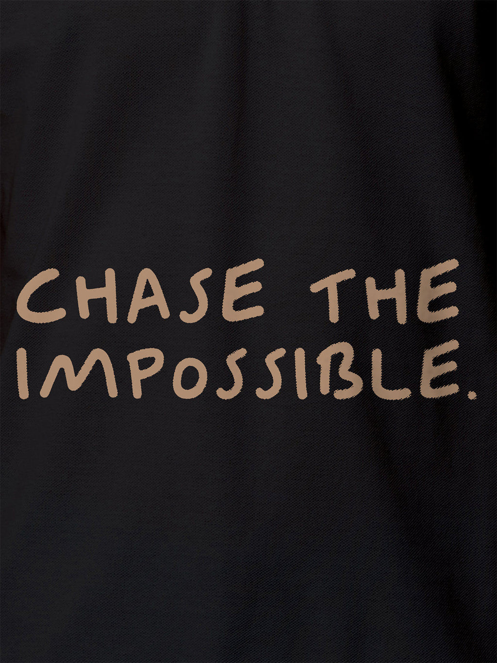 Close up of 'Chase The Impossible' design on Women's Dark Grey Polo T-shirt, highlighting intricate details and vibrant print.