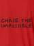 Close up of 'Chase The Impossible' design on Men's Red Polo T-shirt, highlighting intricate details and vibrant print.