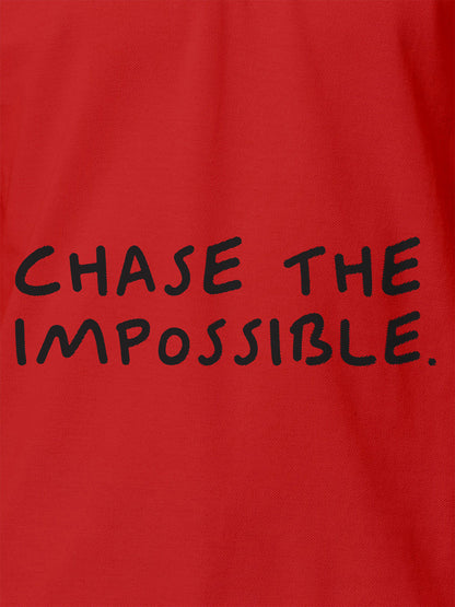 Close up of 'Chase The Impossible' design on Women's Red Polo T-shirt, highlighting intricate details and vibrant print.