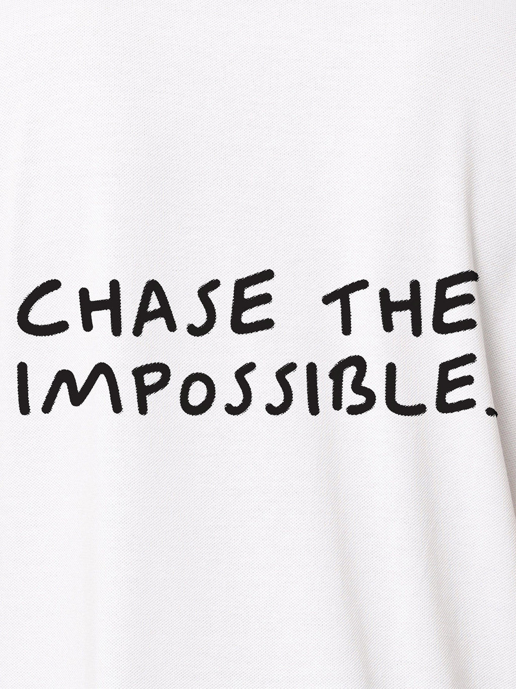 Close up of 'Chase The Impossible' design on Men's White Polo T-shirt, highlighting intricate details and vibrant print.