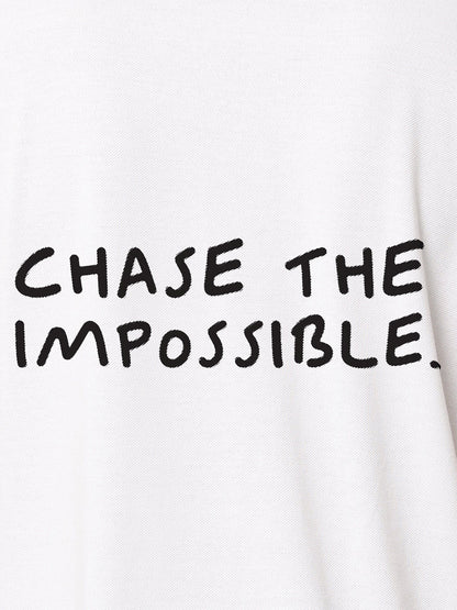 Close up of 'Chase The Impossible' design on Men's White Polo T-shirt, highlighting intricate details and vibrant print.